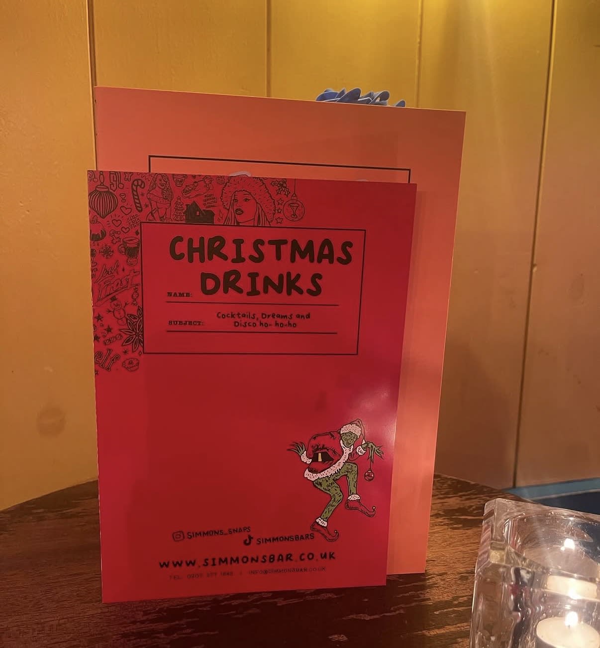 Illustrated red Christmas drinks menu for Simmons Bars
