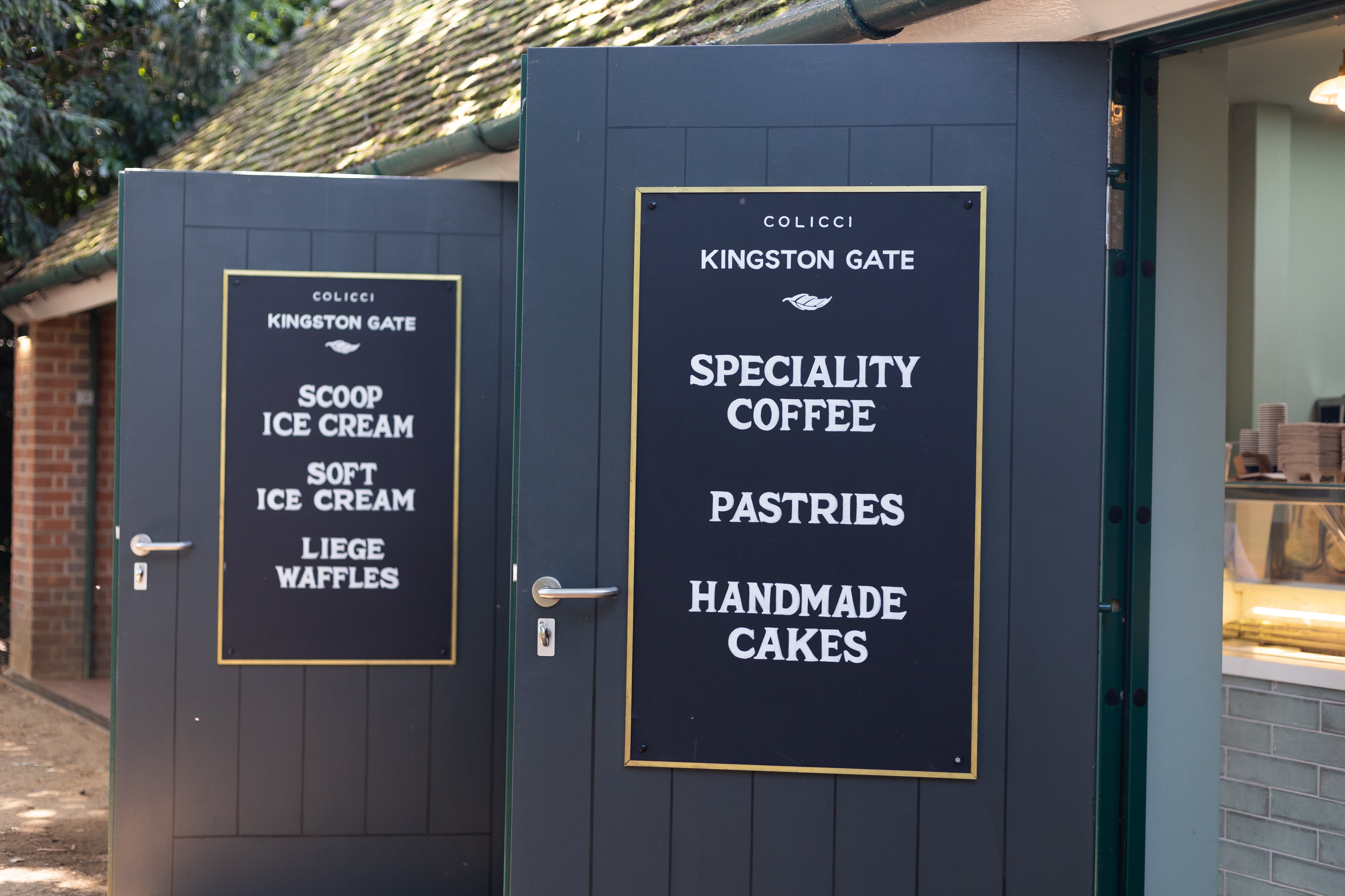 Colicci café doors with hand-lettered coffee, ice cream and cake menus.
