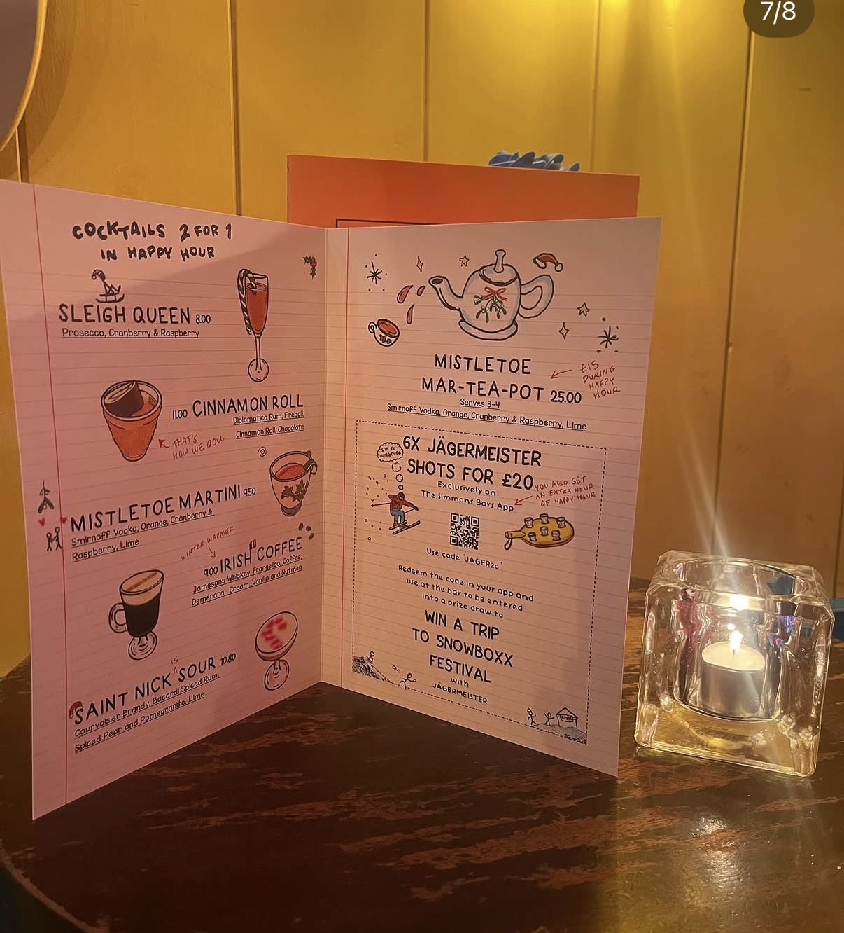 Illustrated Christmas cocktail menu inside a Simmons drinks booklet